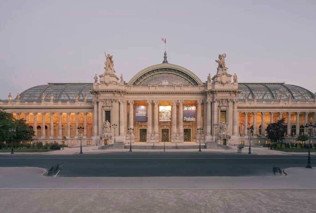 A wide-angle photo of the newly renovated Grand Palais in Paris showcasing its restored glass roof and Beaux-Arts architecture